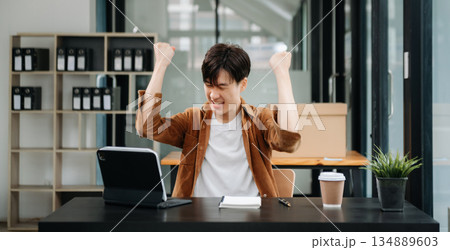 Asian businessman are delighted and happy with the work they do on their tablet, laptop and taking notes at the office. Asian businessman are delighted and happy with the work they do on their tablet, laptop and taking notes at the office. 134889603