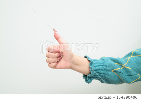 Portrait of a young Asian woman against white background Portrait of a young Asian woman against white background 134890406