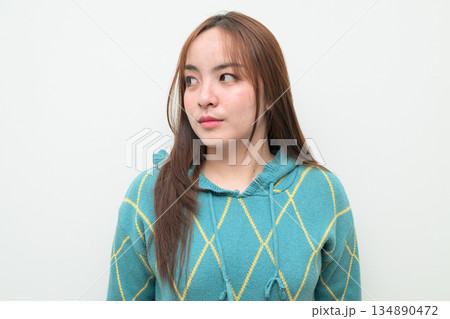 Portrait of a young Asian woman against white background 134890472