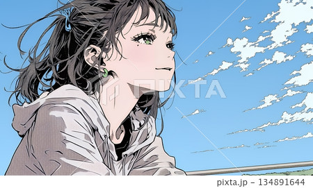 ぼんやり空を見上げている若い女性