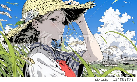 春風に飛ばされそうな帽子を、手で押さえる若い女性