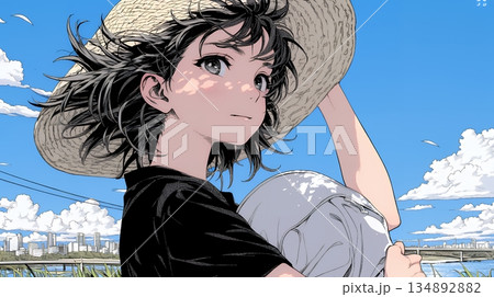 春風に飛ばされそうな帽子を、手で押さえる若い女性 134892882