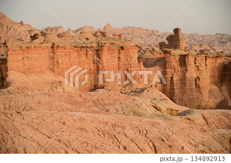Kizil Red Stone Forest Scenic Area in Xinjiang , China is the strangely shaped red rock forests were carved by wind and sand over millions of years, giving them the appearance of abandoned cities. Kizil Red Stone Forest Scenic Area in Xinjiang , China is the strangely shaped red rock forests were carved by wind and sand over millions of years, giving them the appearance of abandoned cities. 134892913