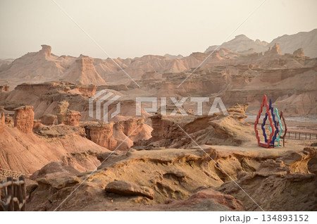 Symbol at Kizil Red Stone Forest Scenic Area in Xinjiang , China is the strangely shaped red rock forests were carved by wind and sand over millions of years. Symbol at Kizil Red Stone Forest Scenic Area in Xinjiang , China is the strangely shaped red rock forests were carved by wind and sand over millions of years. 134893152