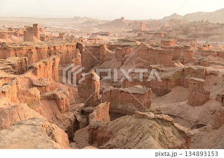 Kizil Red Stone Forest Scenic Area in Xinjiang , China is the strangely shaped red rock forests were carved by wind and sand over millions of years, giving them the appearance of abandoned cities. Kizil Red Stone Forest Scenic Area in Xinjiang , China is the strangely shaped red rock forests were carved by wind and sand over millions of years, giving them the appearance of abandoned cities. 134893153