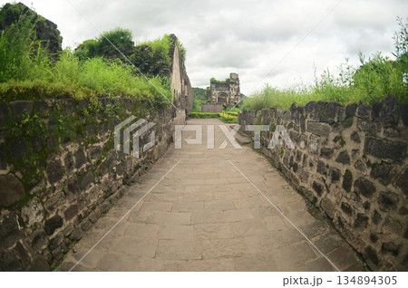 Footpath at Daulatabad Fort is an ancient fort located in Maharashtra, India. Originally named Deogiri,fort built from natural rocks and is very strong. it is a fort built from natural rocks. Footpath at Daulatabad Fort is an ancient fort located in Maharashtra, India. Originally named Deogiri,fort built from natural rocks and is very strong. it is a fort built from natural rocks. 134894305