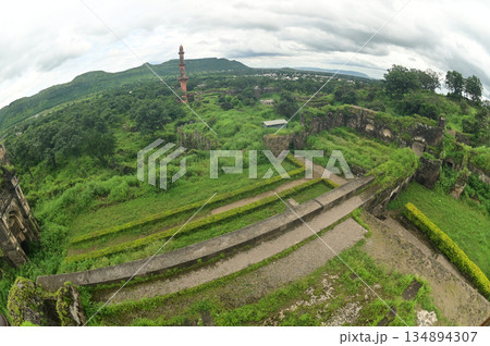 Top view of Daulatabad fort and Chand Minar (Tower of the Moon) , Built with massive stone walls showcasing medieval military architecture and cultural heritageIt. 134894307