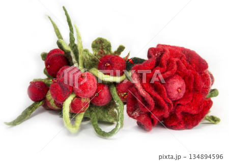 Wrap hair with flowers decoration in the form of felted wool on a white background Wrap hair with flowers decoration in the form of felted wool on a white background 134894596