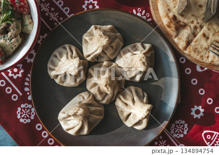 Traditional Georgian Khinkali Dumplings on a Plate Traditional Georgian Khinkali Dumplings on a Plate 134894754