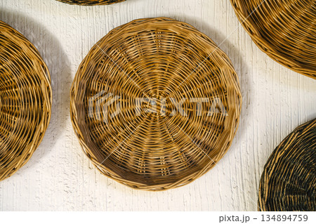 Woven Rattan Baskets Wall Decor Background 134894759