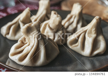 Traditional Georgian Khinkali Dumplings on a Plate Traditional Georgian Khinkali Dumplings on a Plate 134894761