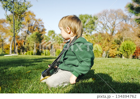 Child Learning Photography with Camera in Nature Child Learning Photography with Camera in Nature 134894762