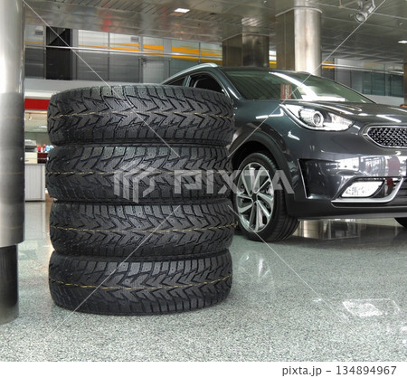 New vehicle tires stacked in the dealership showroom New vehicle tires stacked in the dealership showroom 134894967