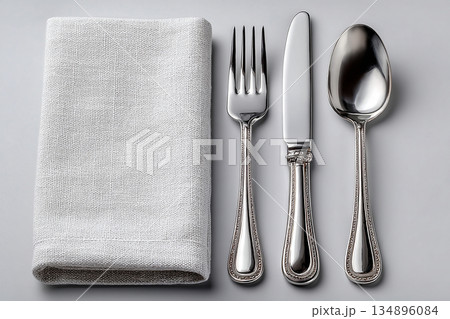 Wedding invitations. Set for everyday dining, Fork, knife and spoon on a white background. Dining settings. 134896084