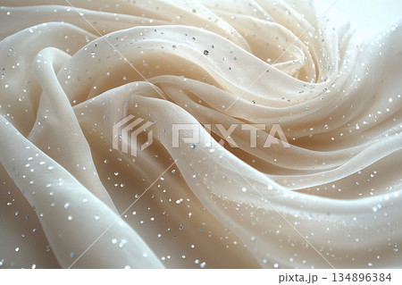 Perfect for premium branding. Bridal tulle fabric with crystal embellishments on a white background. 134896384