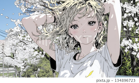 満開の桜の下、春風に乱れた髪を整える若い女性