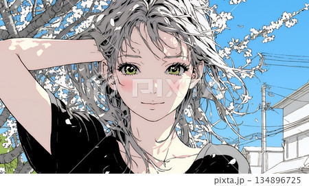 満開の桜の下、春風に乱れた髪を整える若い女性