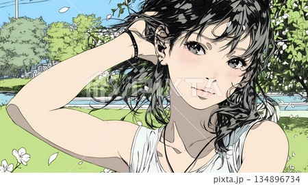 満開の桜の下、春風に乱れた髪を整える若い女性