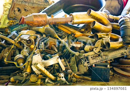 Parts of dismantled cars. Scrap metal parts for old cars 134897081