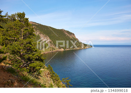 View above big beautiful lake, Baikal lake, Russia. Sunny summer evening View above big beautiful lake, Baikal lake, Russia. Sunny summer evening 134899018