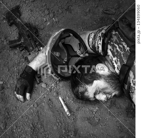 Wounded soldier laying on the ground Wounded soldier laying on the ground 134899060