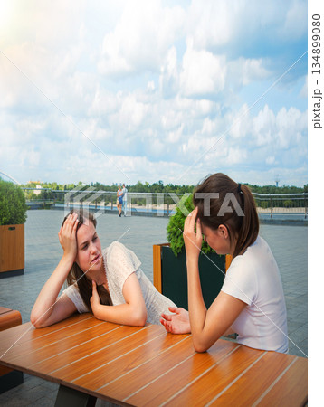 Young girls in a cafe Young girls in a cafe 134899080