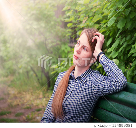 Young pretty girl on the bench Young pretty girl on the bench 134899081
