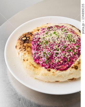 Colorful vegetarian dish, Bright beet and ricotta herb crust dish 134899135