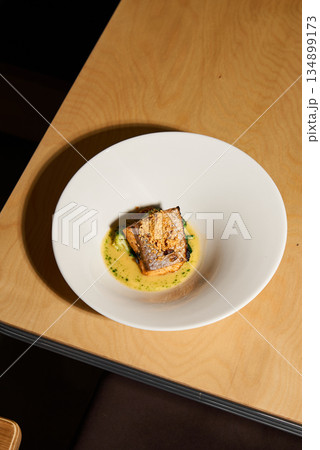 Delicately Cooked Fillet Artfully Plated, Carefully Arranged Seared Fillet Showcases Crust And Symmetry 134899173