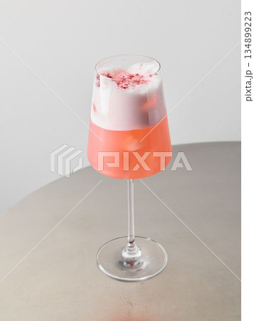 Detailed view of creamy strawberry drink in fashionable glass container 134899223