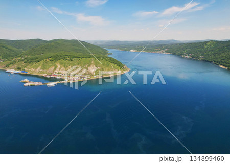 Aerial view of the port of Baikal and the source of the Angara River. Lake Baikal in summer Aerial view of the port of Baikal and the source of the Angara River. Lake Baikal in summer 134899460
