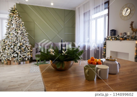 Christmas home interior. Large Christmas tree, decorated fireplace. Christmas home interior. Large Christmas tree, decorated fireplace. 134899602