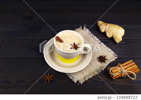 A cup of masala tea. Tradition Indian tea drink with milk and spices. A cup of masala tea. Tradition Indian tea drink with milk and spices. 134899722