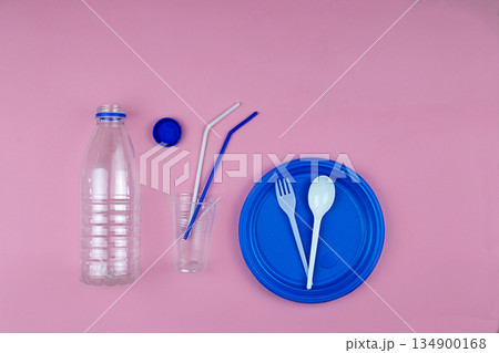 Empty plastic bottle, tableware, waste. Say no to single use plastic. 134900168