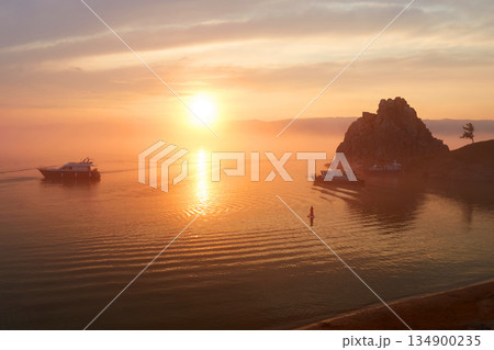 Colorful sunset over Lake Baikal. View of the Khuzhir Bay near the Shaman rock. 134900235