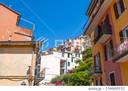 Italian shutters on the windows balcony of multicolored house. Summer in Cinque Terre 134900552