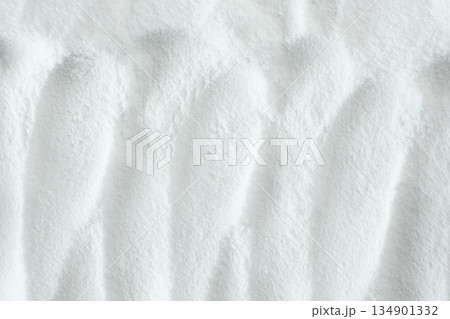 Soda powder sodium bicarbonate surface. Abstract white background. White texture with wavy patterns top view Soda powder sodium bicarbonate surface. Abstract white background. White texture with wavy patterns top view 134901332