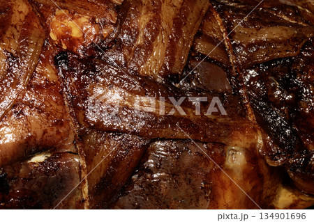 Close up of bacon covered roast chicken cooked in the oven and meat ready to be eaten Close up of bacon covered roast chicken cooked in the oven and meat ready to be eaten 134901696
