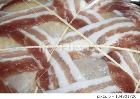 Close up of sausages and bacon ready to be cooked for dinner 134901720