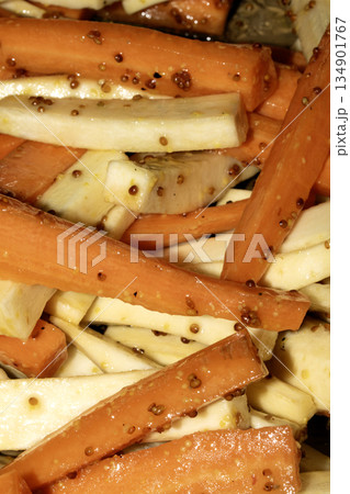 Close up of roasted vegetables honey and mustard parsnip and carrots side dish for Sunday roast dinner 134901767