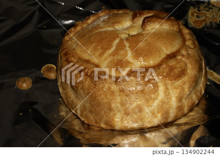 Close up of a glazed pastry home made pie just cooked Close up of a glazed pastry home made pie just cooked 134902244