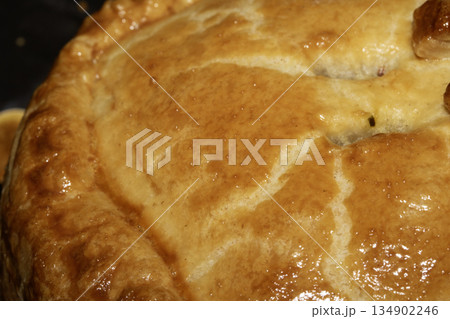 Close up of a glazed pastry home made pie just cooked Close up of a glazed pastry home made pie just cooked 134902246