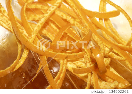 Close up of orange peel slices thin grated fruit Close up of orange peel slices thin grated fruit 134902261