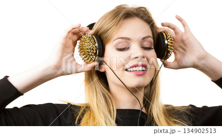 Teenage woman wearing headphones 134902513