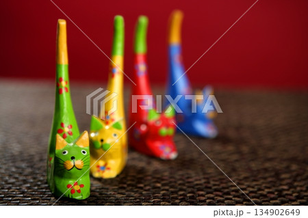 four handcraft cats in colors still over tablecloth four handcraft cats in colors still over tablecloth 134902649