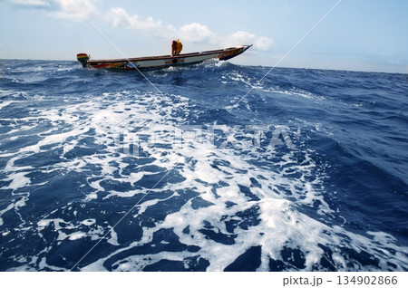 African motorboat in atlantic blue water 134902866
