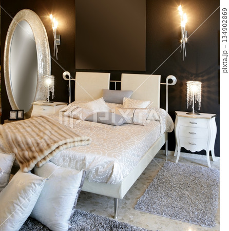 bedroom modern silver oval mirror white bed 134902869
