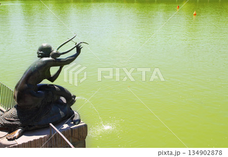 Madrid Sirena con Lira statue in Retiro lake Madrid Sirena con Lira statue in Retiro lake 134902878