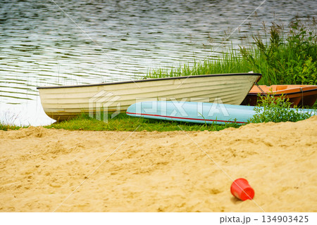 Boat on lake shore Boat on lake shore 134903425