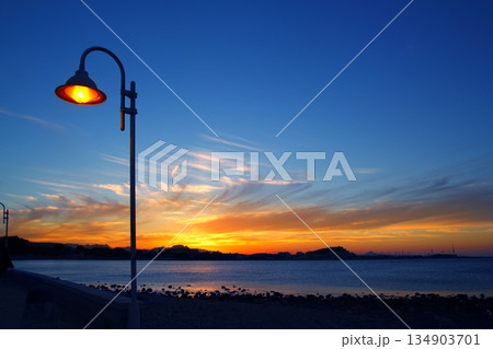 Sunset orange blue seascape light lamppost 134903701